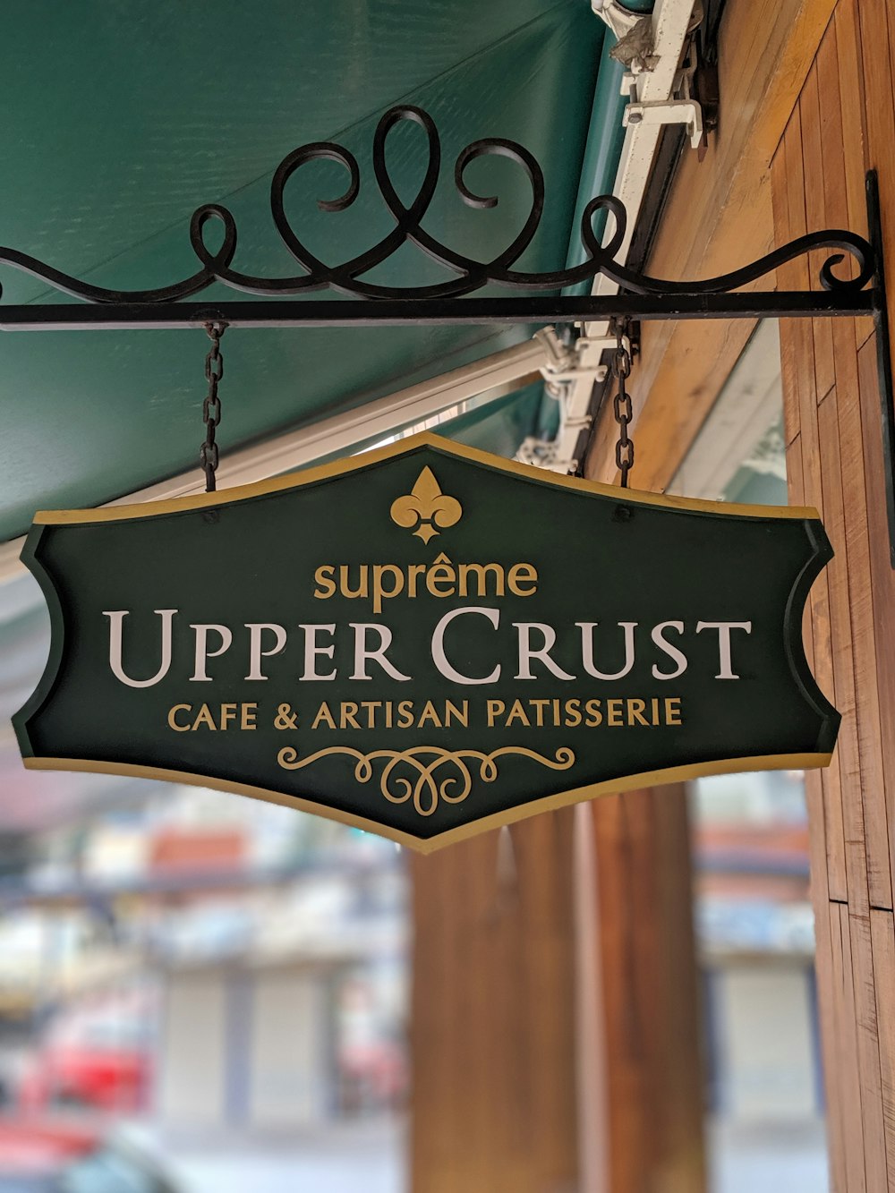 Supreme Upper Crust Cafe & Artisan Patisserie sign