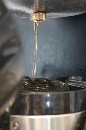 Side view of epoxy machine with resin pouring process