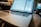 A close-up of a laptop screen displaying a positive customer review.
