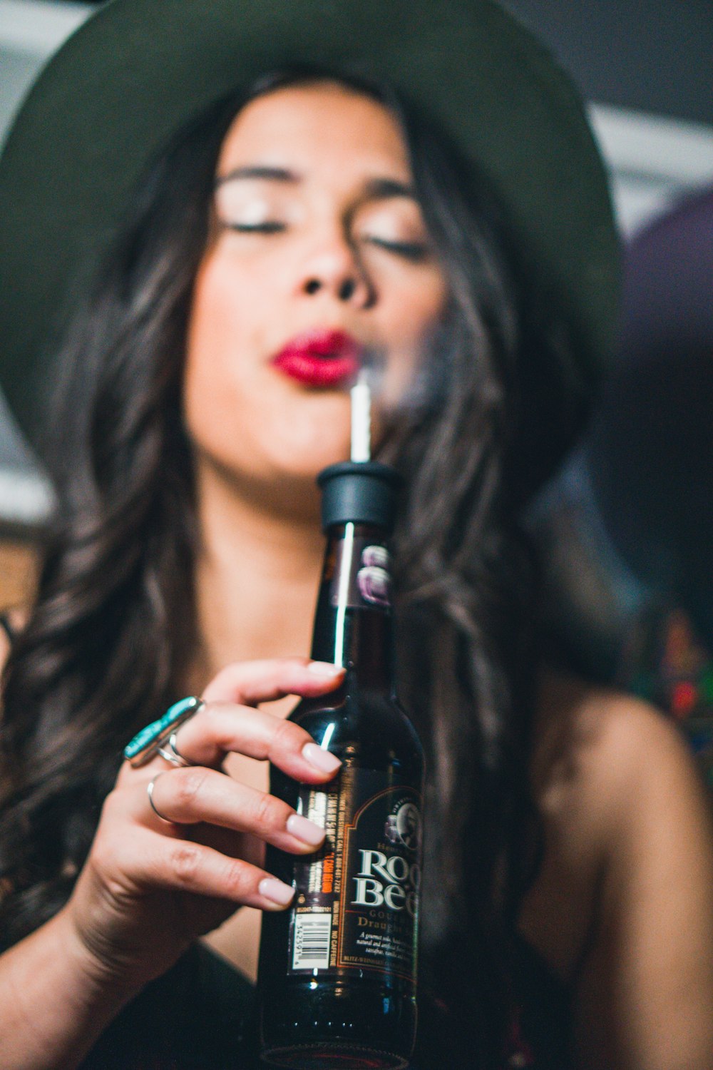 woman holding root beer