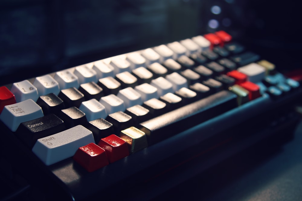 white and red wireless computer keyboard