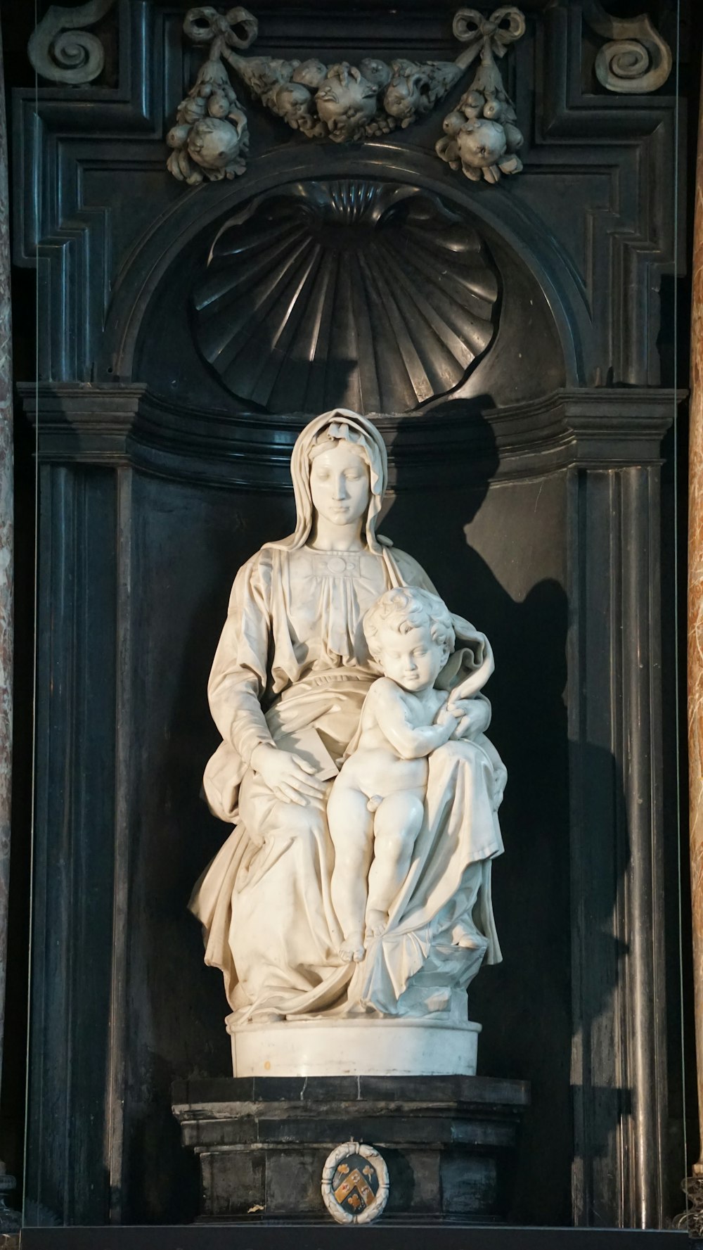 a statue of a woman holding a child