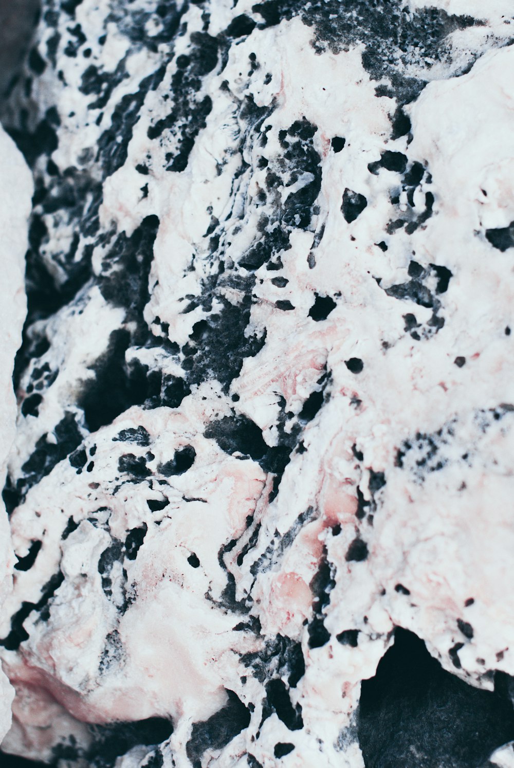 a close up of a black and white substance