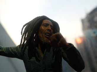 A powerful image of Thomas Sankara speaking passionately at a rally, vibrant earth tones highlighting his presence.