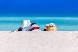 person lying on shore