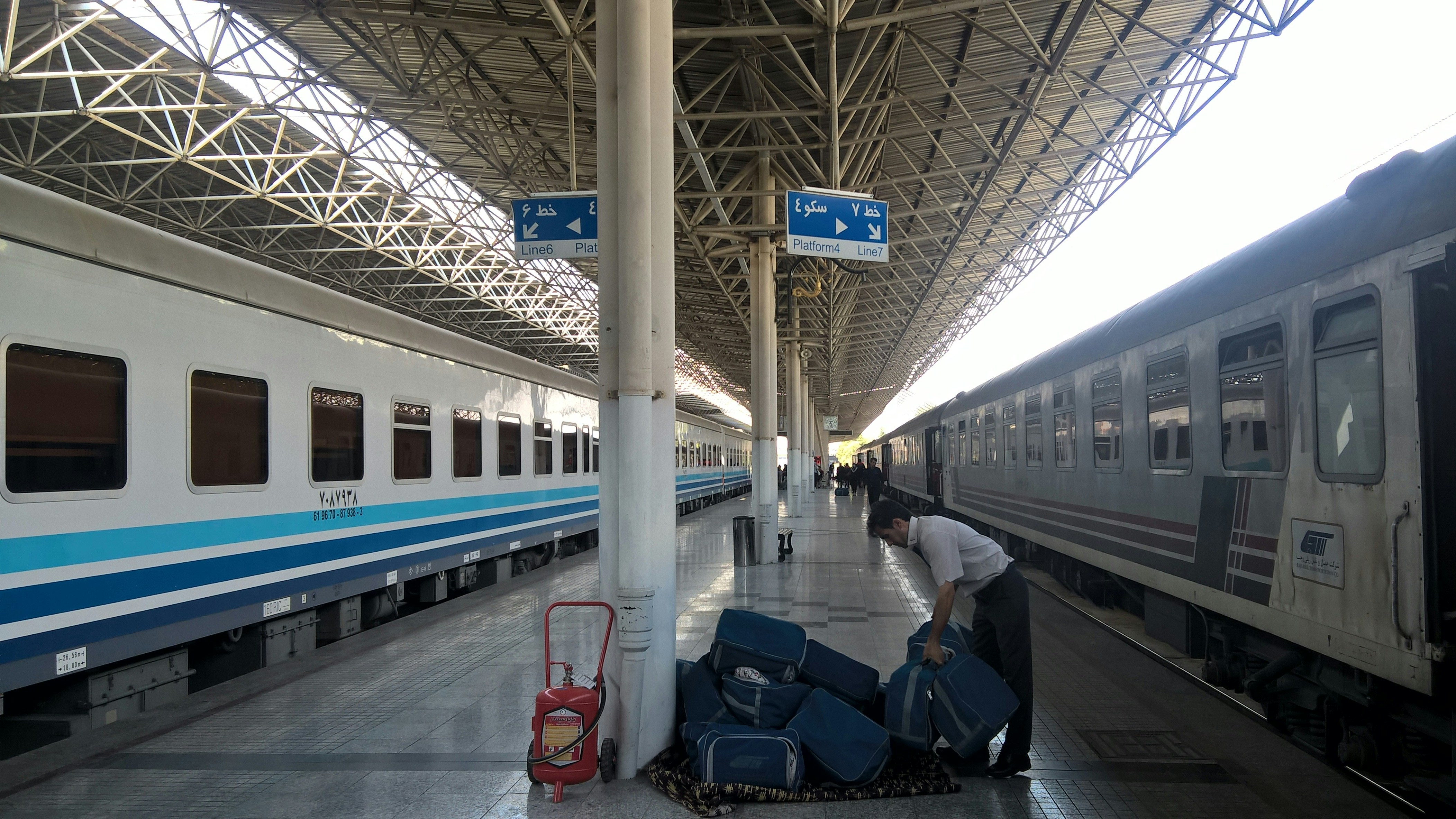 man standing on train station