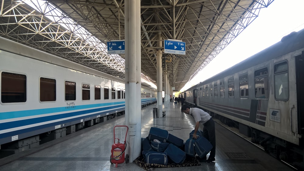 man standing on train station