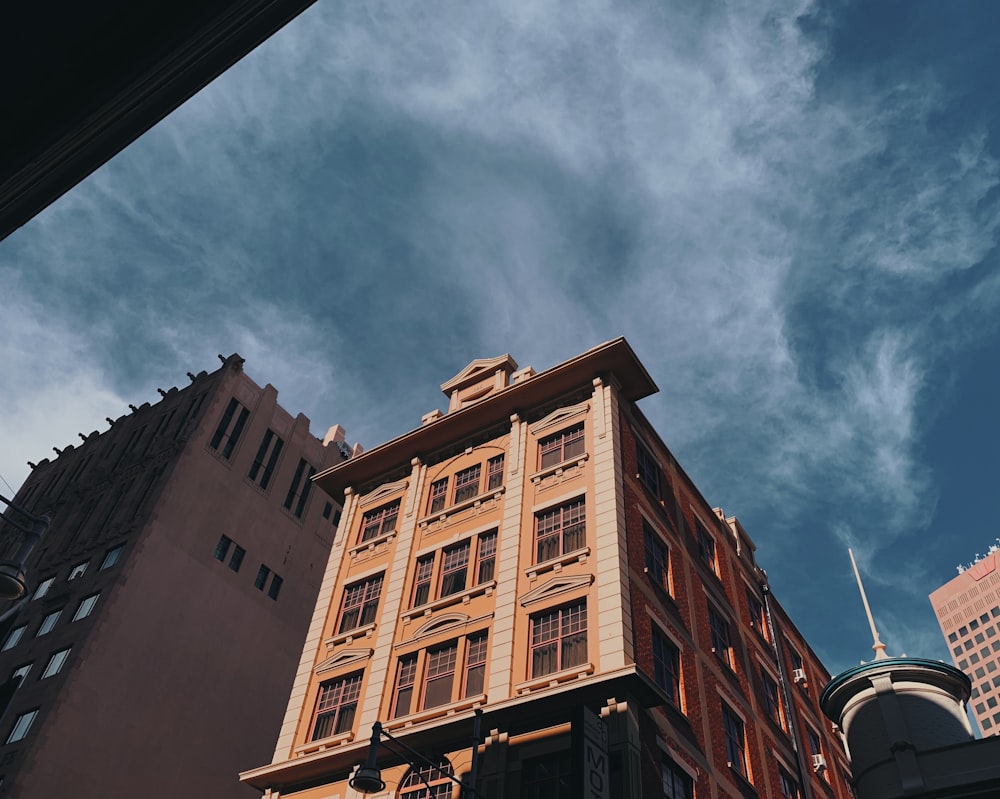 low angle photography of brown building