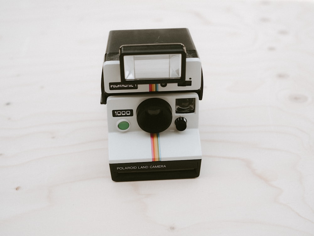 white Polaroid land camera