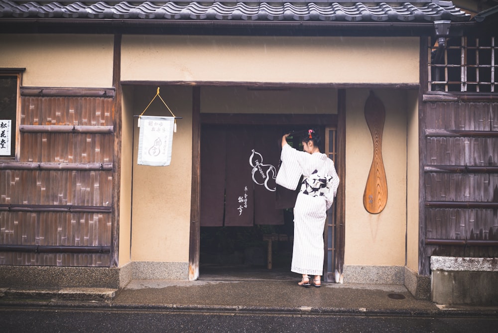 woman standing near door