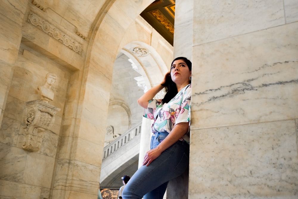 woman leaning on wall