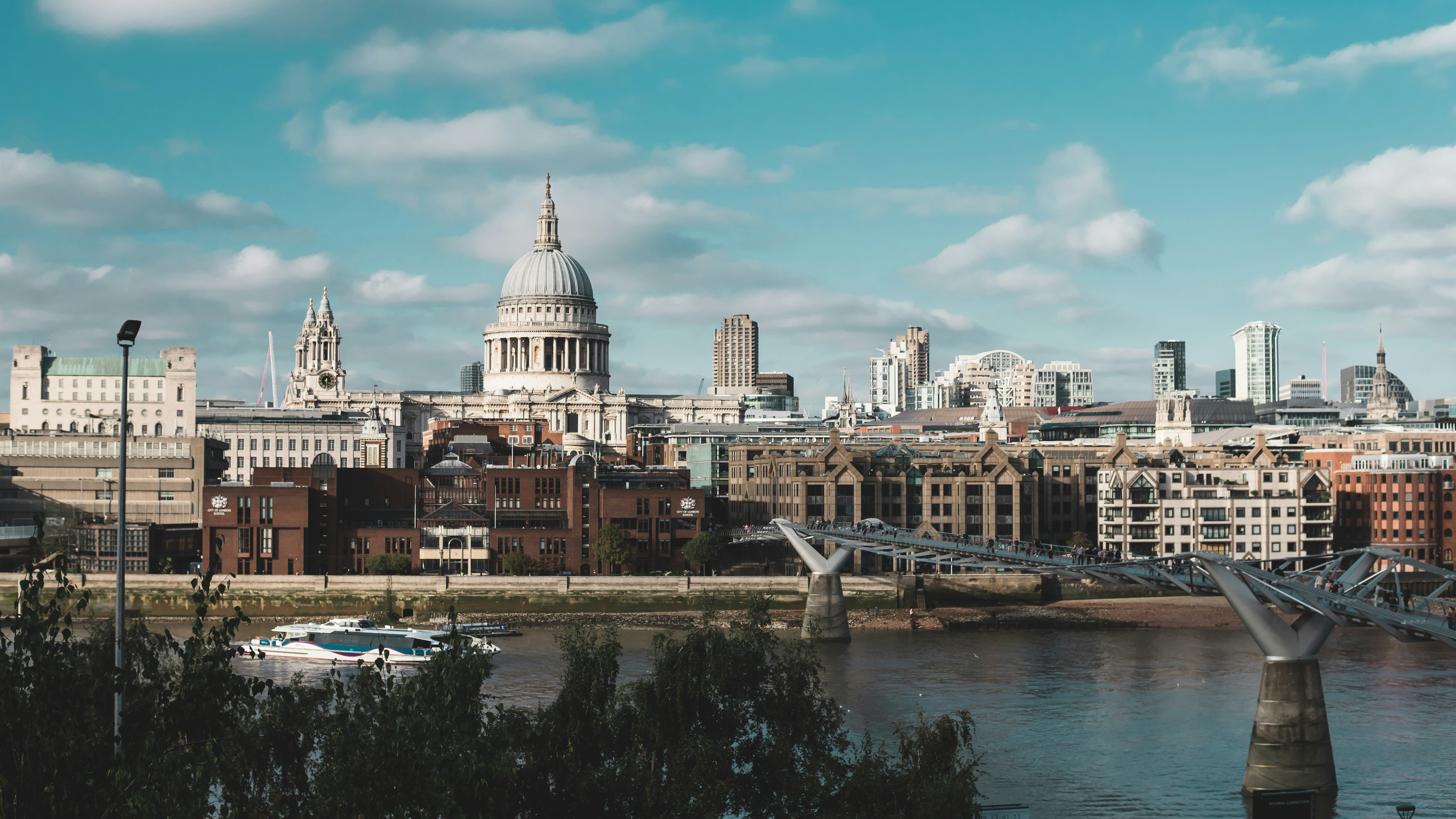 buildings near body of water, The view of St. Paul Cathedral and the Millenium Bridge from Tate Modern balcony