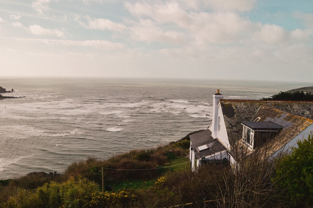 aerial photo of house beside sea