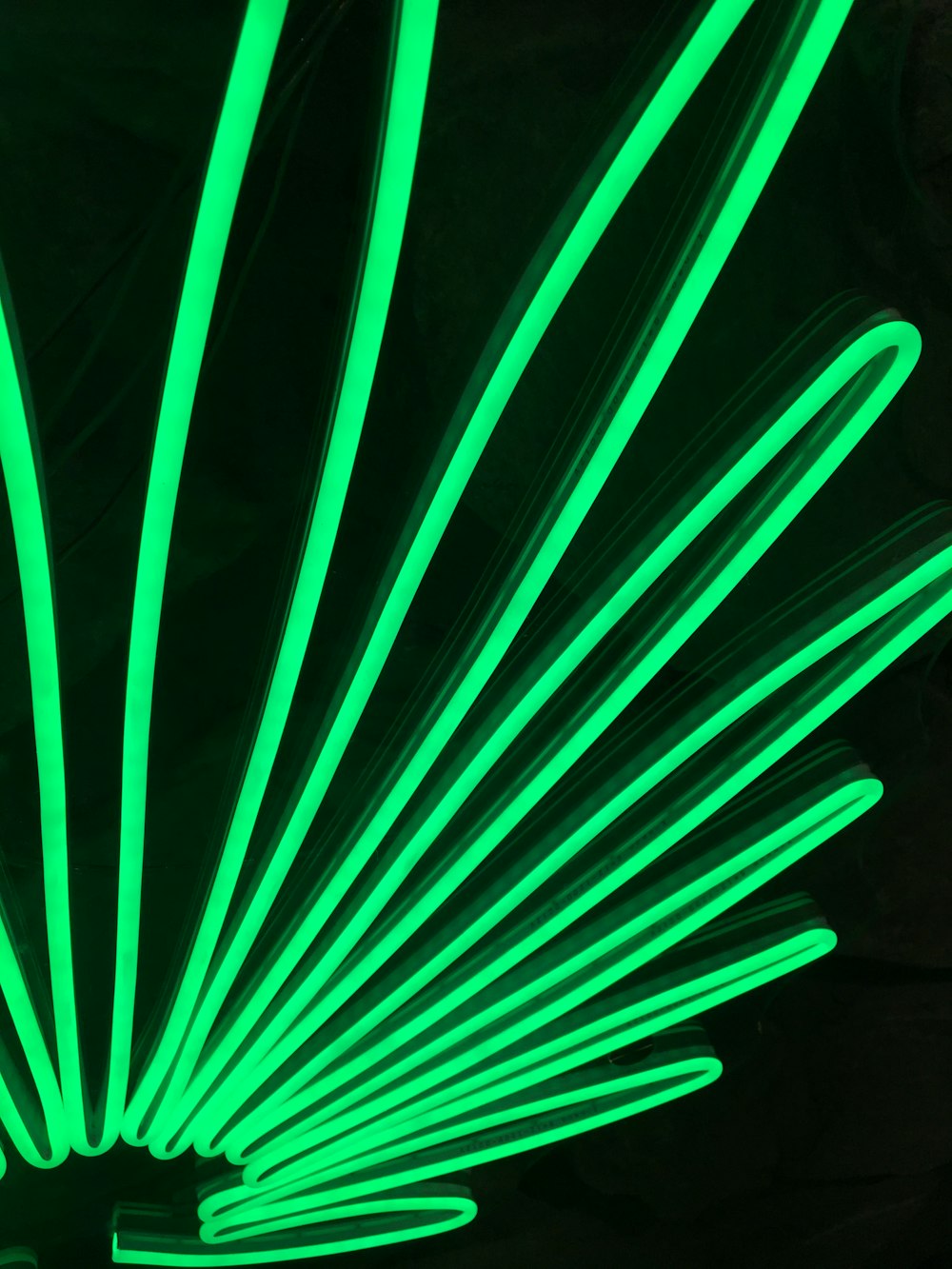a close up of a bunch of neon green straws