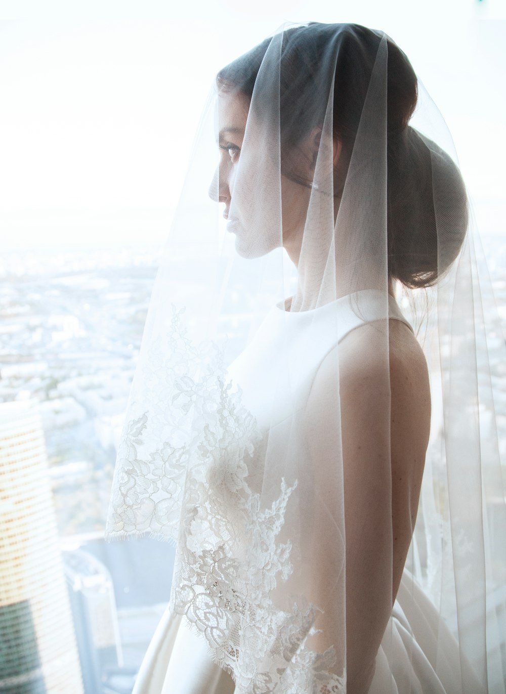 woman looking outside window