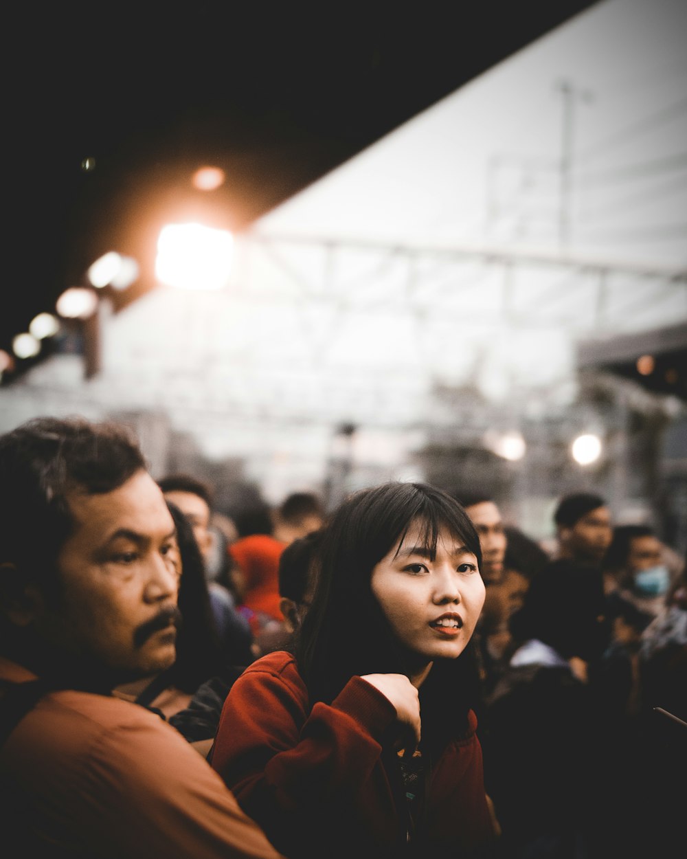 group of people sitting on bleachers