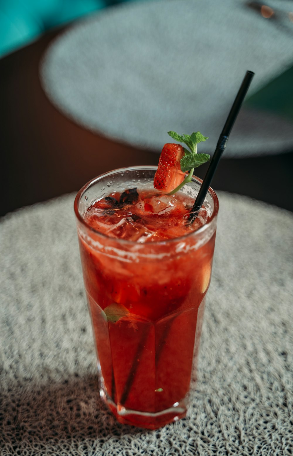 clear drinking glass with red tea