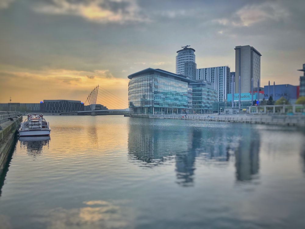 architectural photography of gray building near body of water