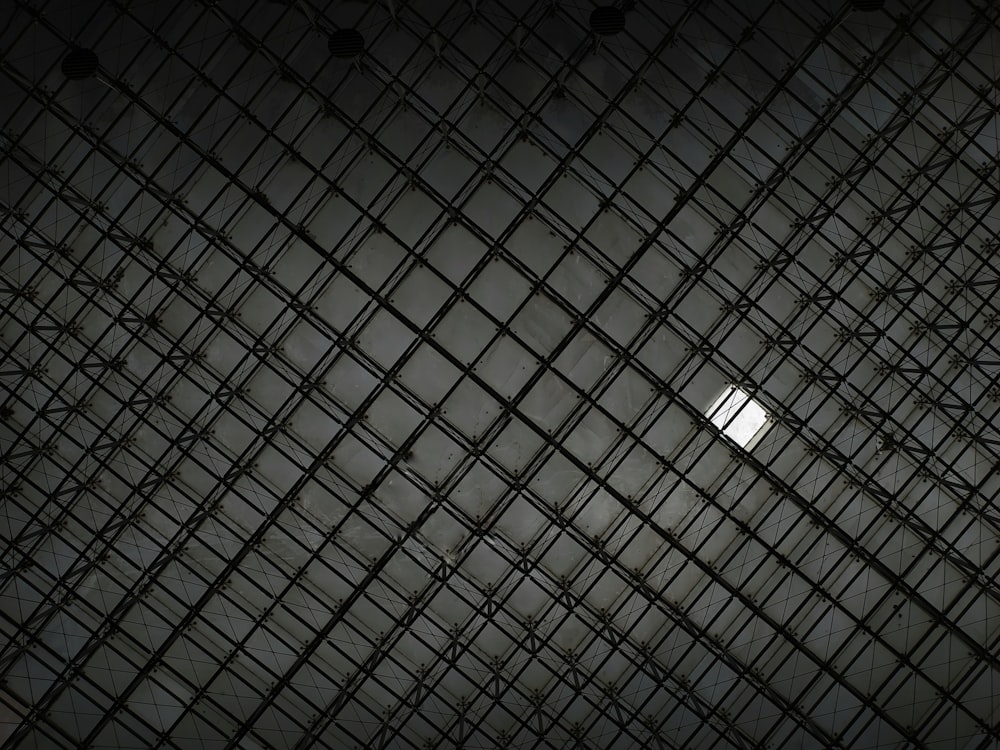 a view of the ceiling of a building in the dark