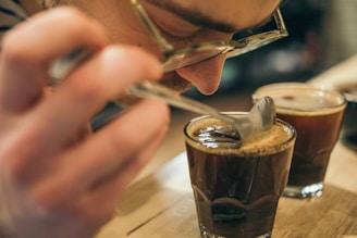 clear drinking glass on brown wooden surface