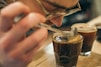 clear drinking glass on brown wooden surface
