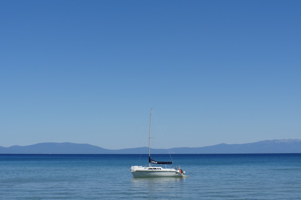 sail boat on body of water during daytime