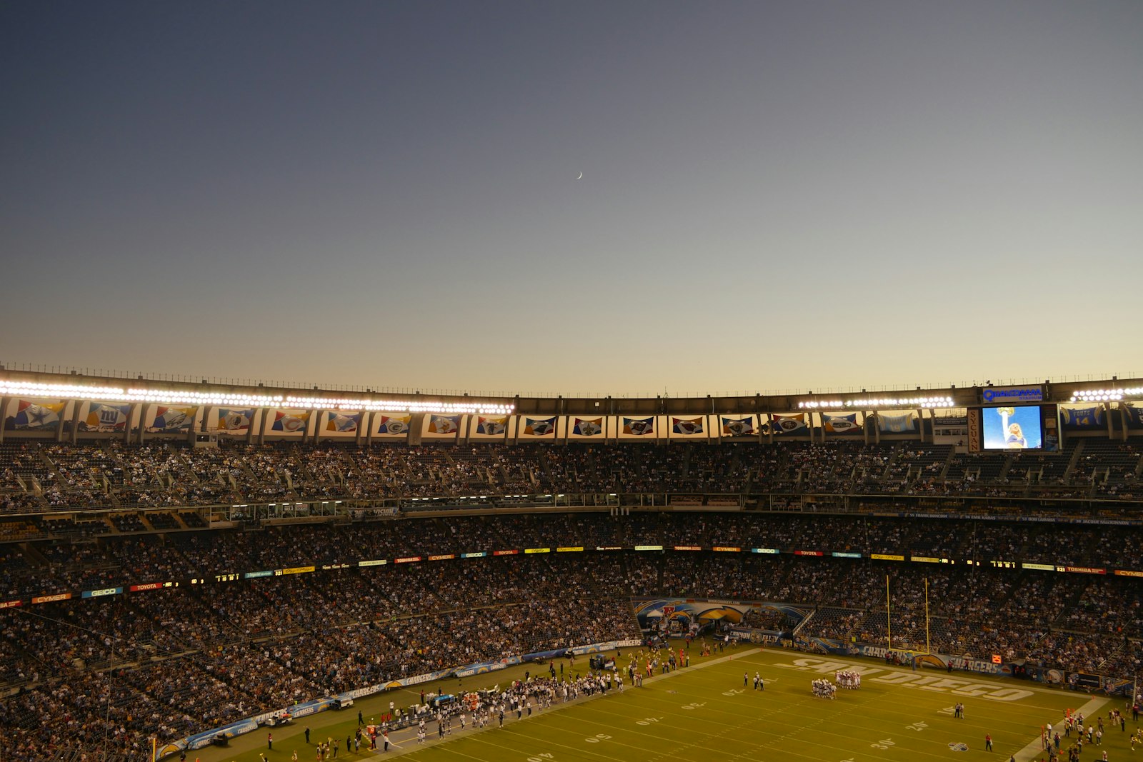 A football field viewed from the stands during a game