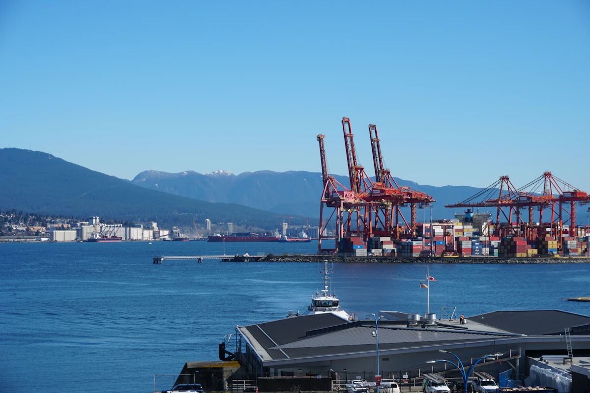 A large passenger ship alongside a waterfront terminal in Vancouver