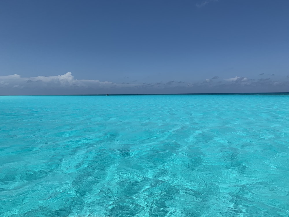 a body of water with a boat in the distance