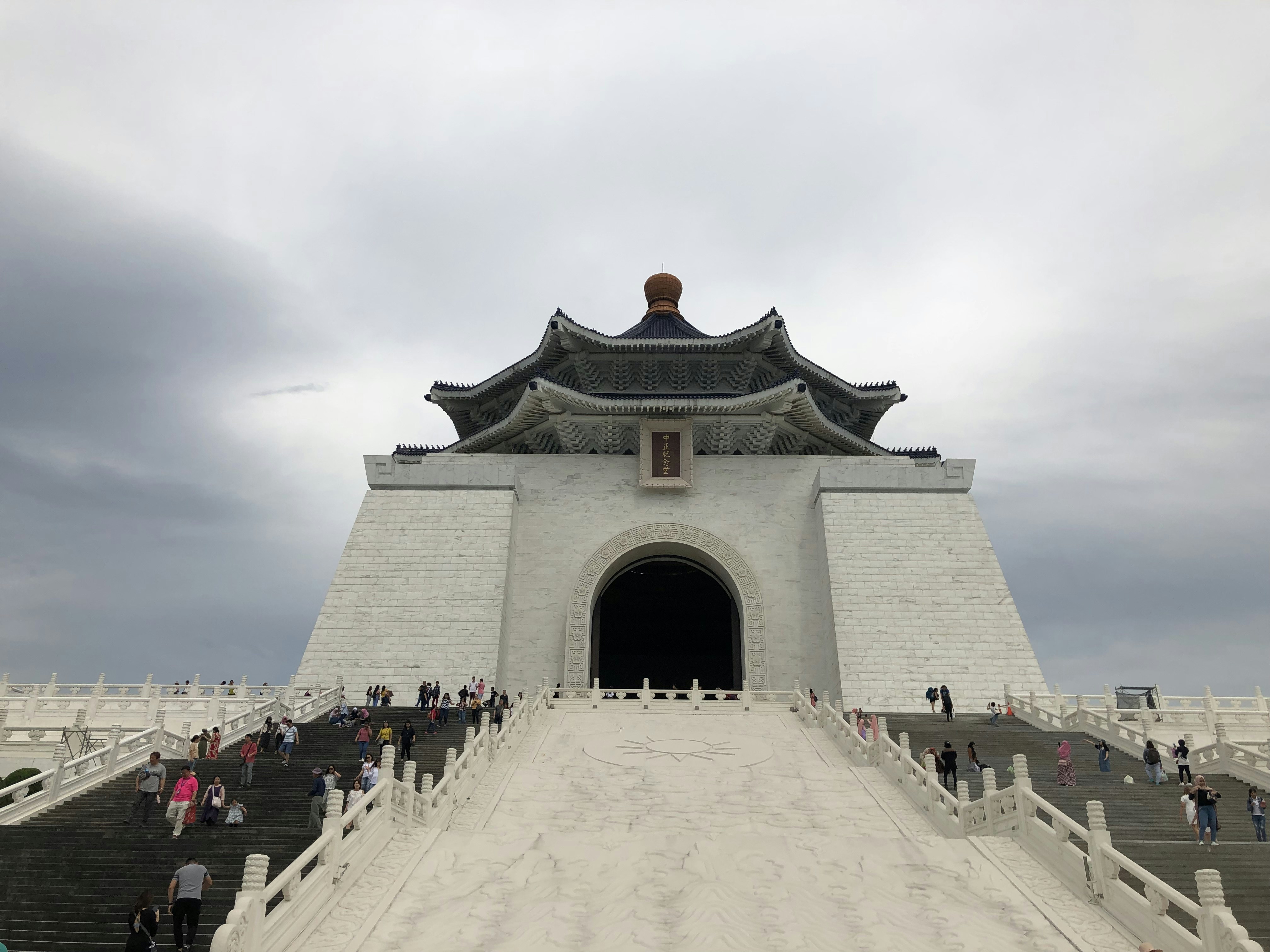 a large white building with stairs leading up to it