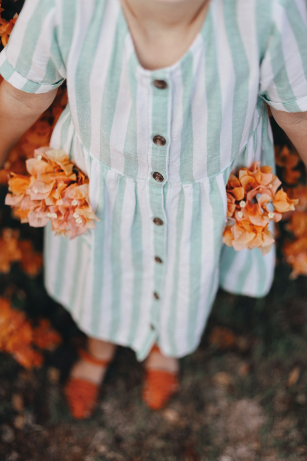 woman wearing green and white striped dress