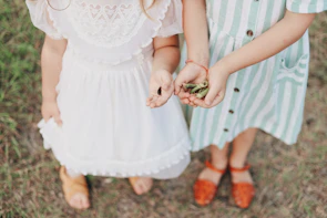 Children dressed in vintage clothing participating in a historical reenactment at the community center.