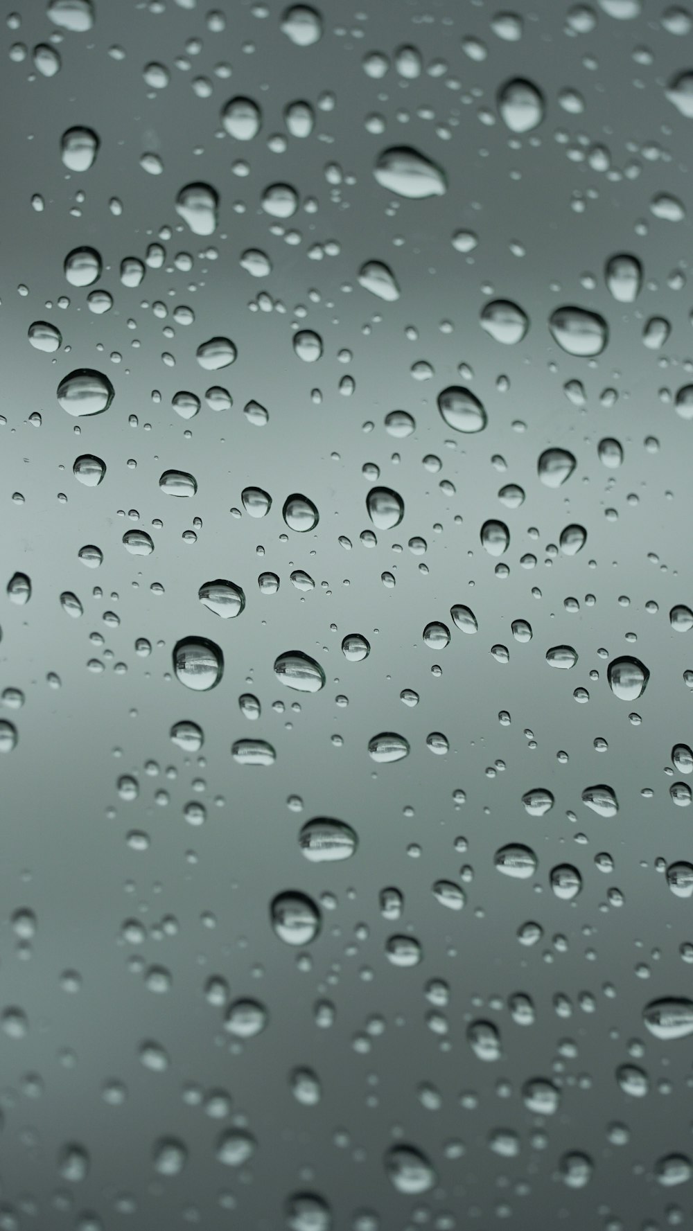 a close up of a rain covered window