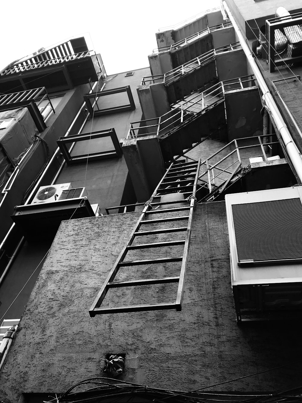 grayscale photo of ladder