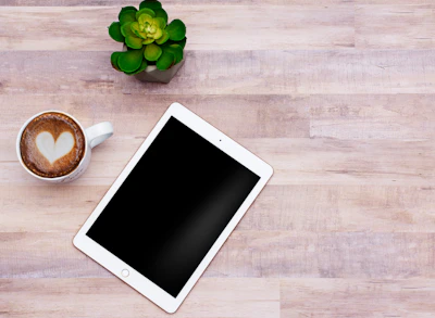 An inviting flat lay of the digital guidebook displayed on a tablet surrounded by calming botanical elements.