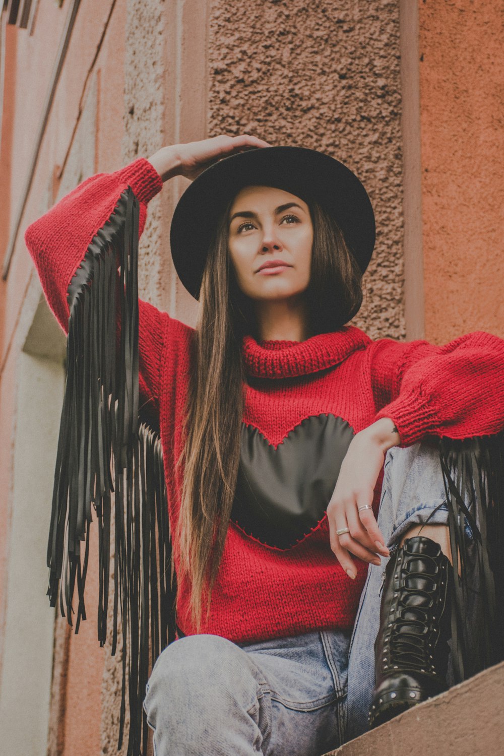 woman wearing red and black knit sweater