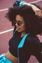 A stylish woman wearing comfortable fitness casual clothing outdoors.