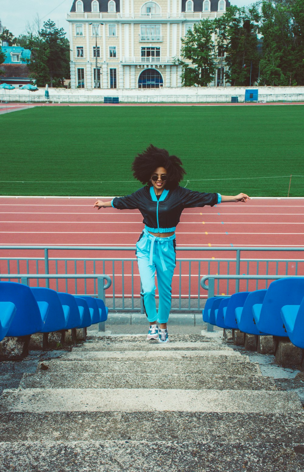 woman in black and blue shirt and pants