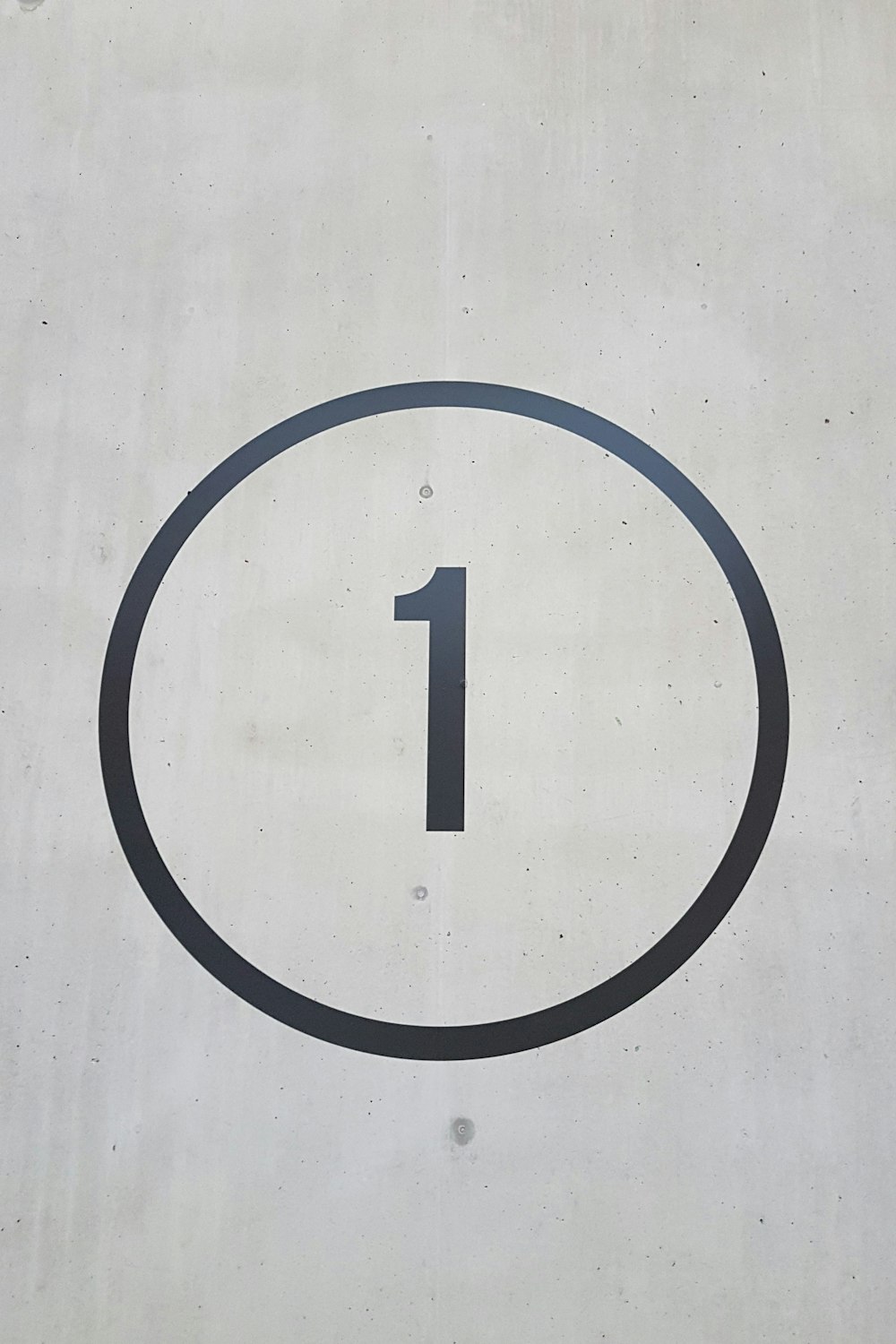 A number one sign on the side of a building photo – Free Grey Image on  Unsplash