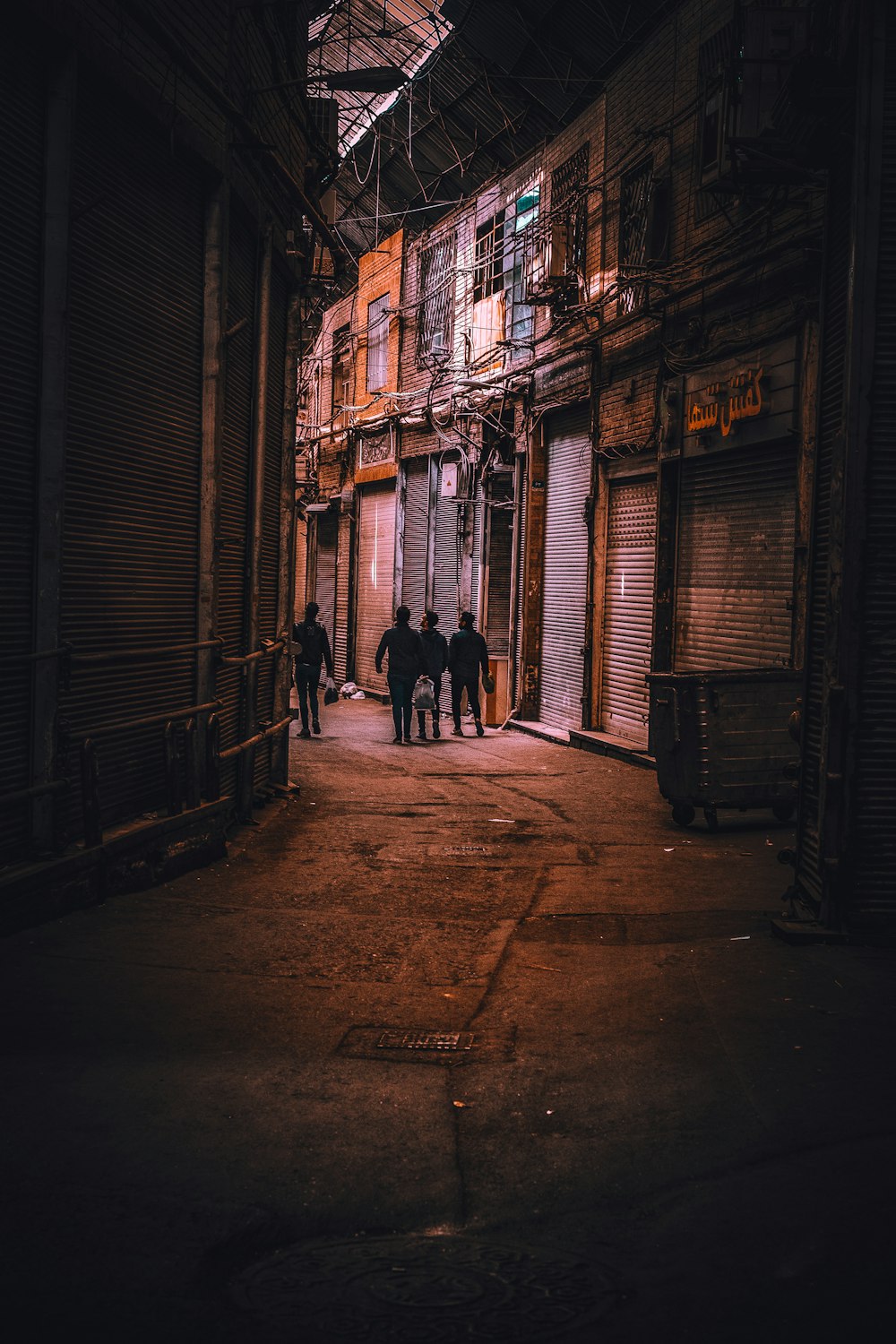 silhouette of person walking on street