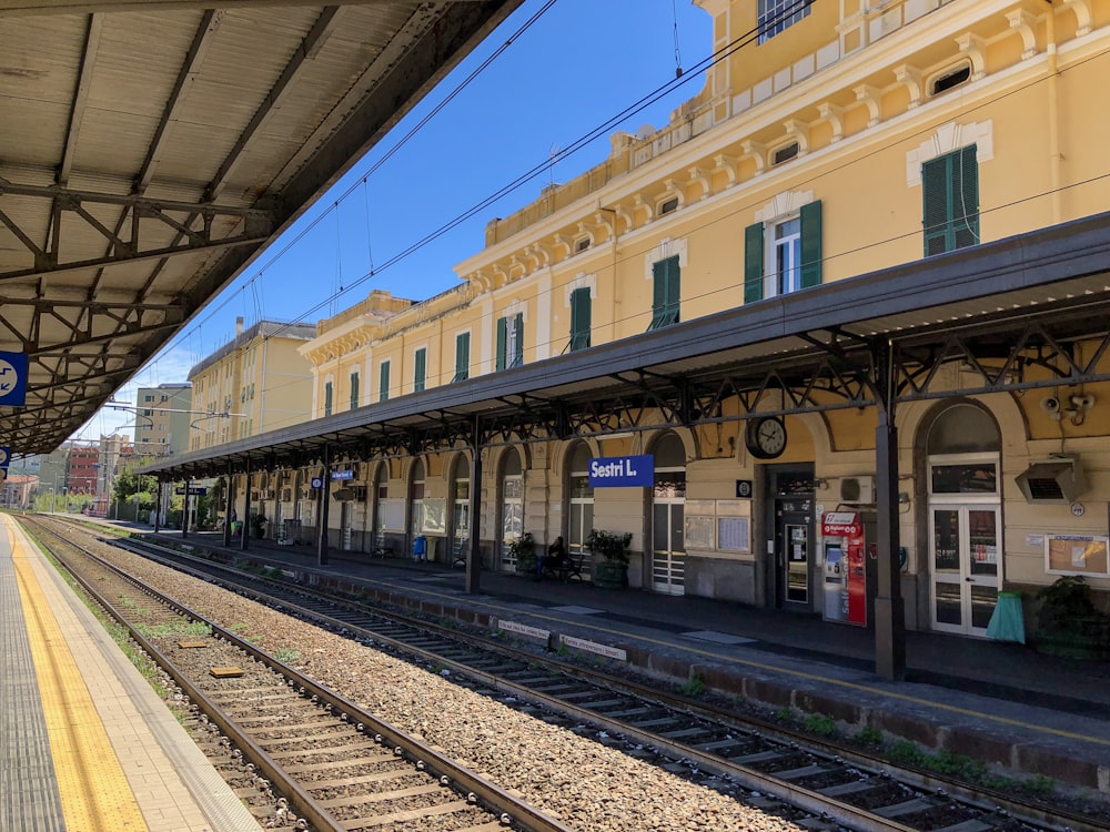 photography of gray trail rail during daytime