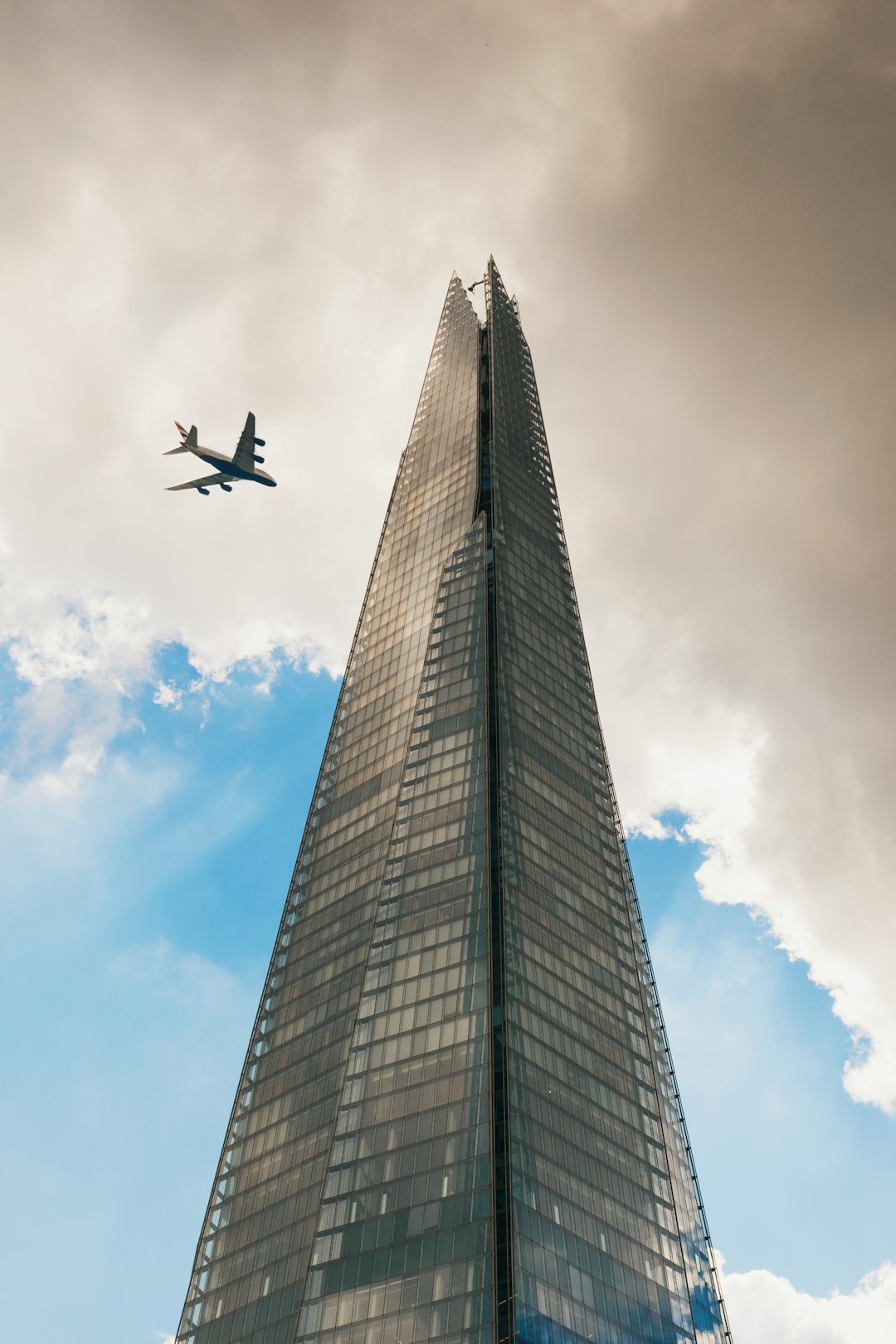 grey curtain building under white clouds