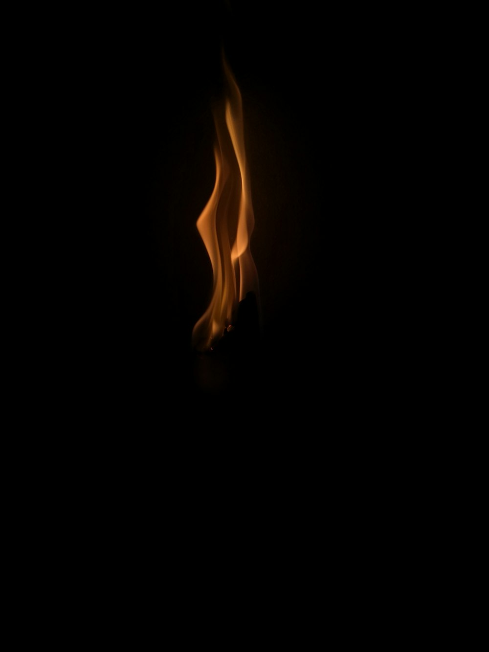 a close up of a fire on a black background