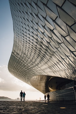 architectural photography,how to photograph two person standing beside gray structure