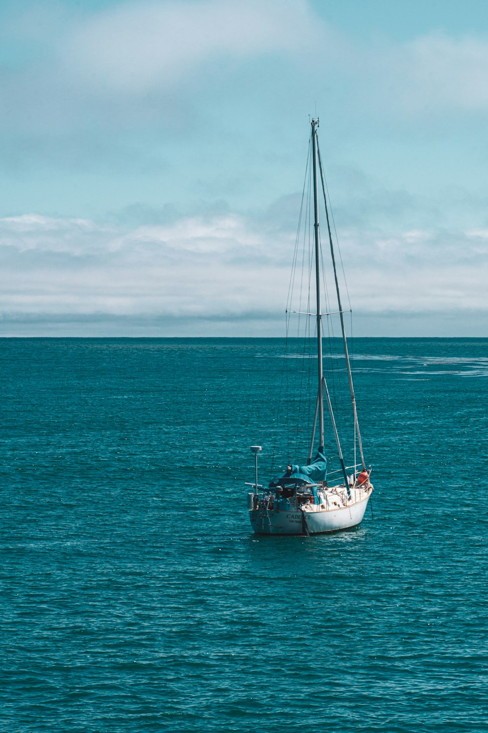 white boat on body of water