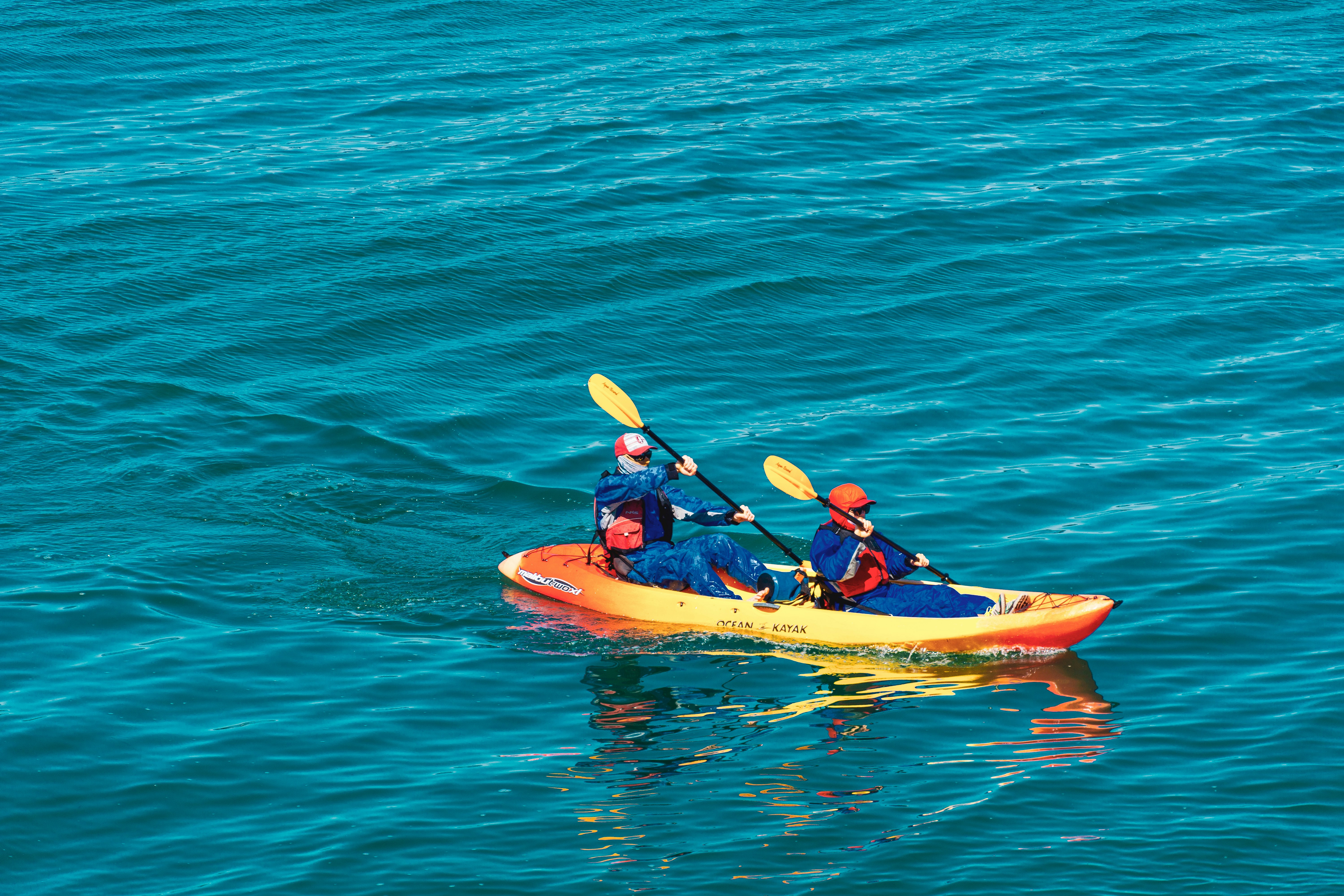 two person riding on kayak