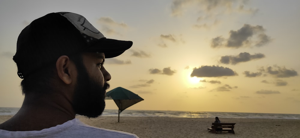 man wearing black fitted cap