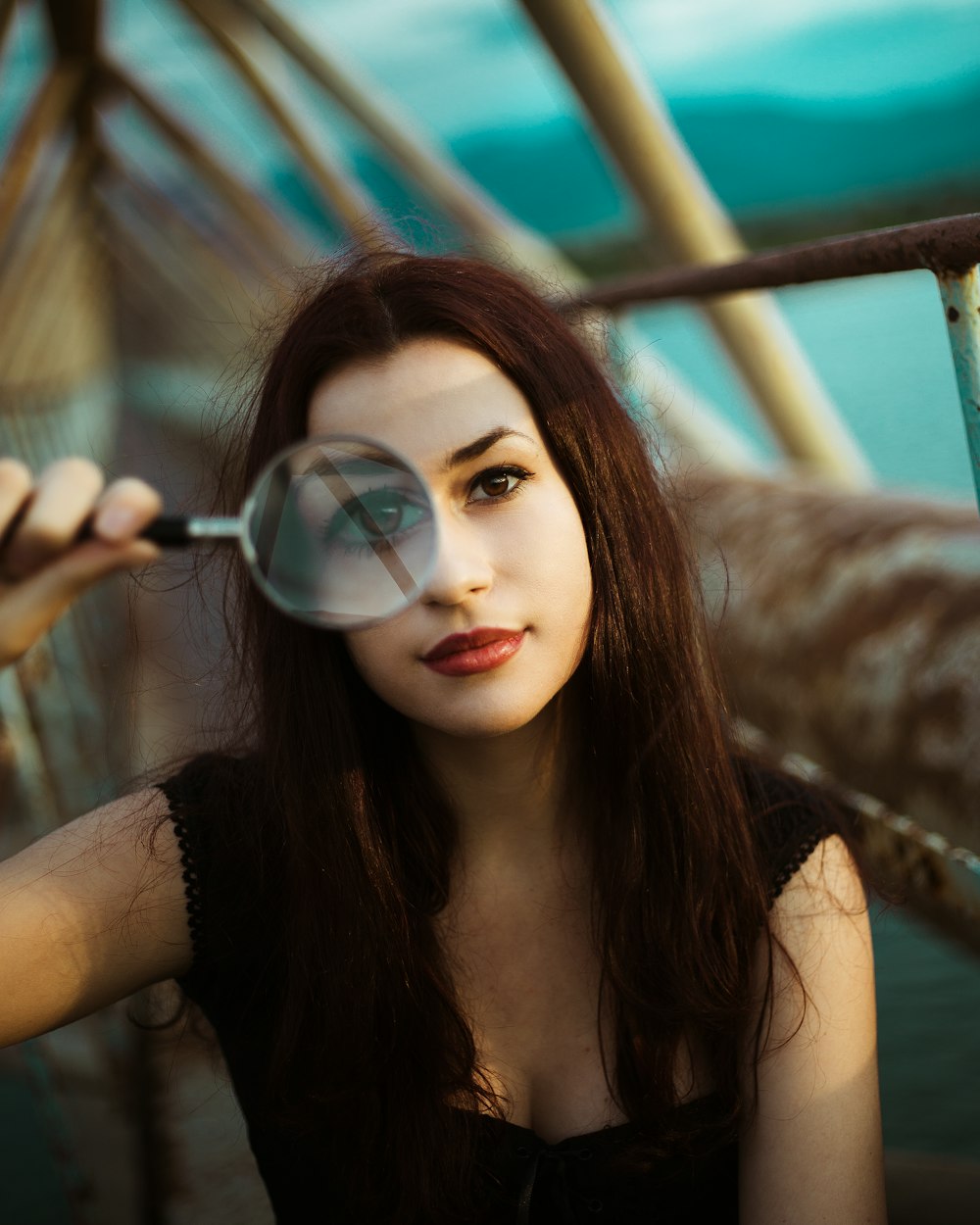 woman holding a magnifying glass