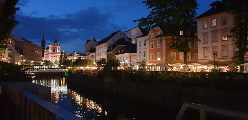 Evening lights illuminating Peterborough’s cathedral, with visitors enjoying the scene.