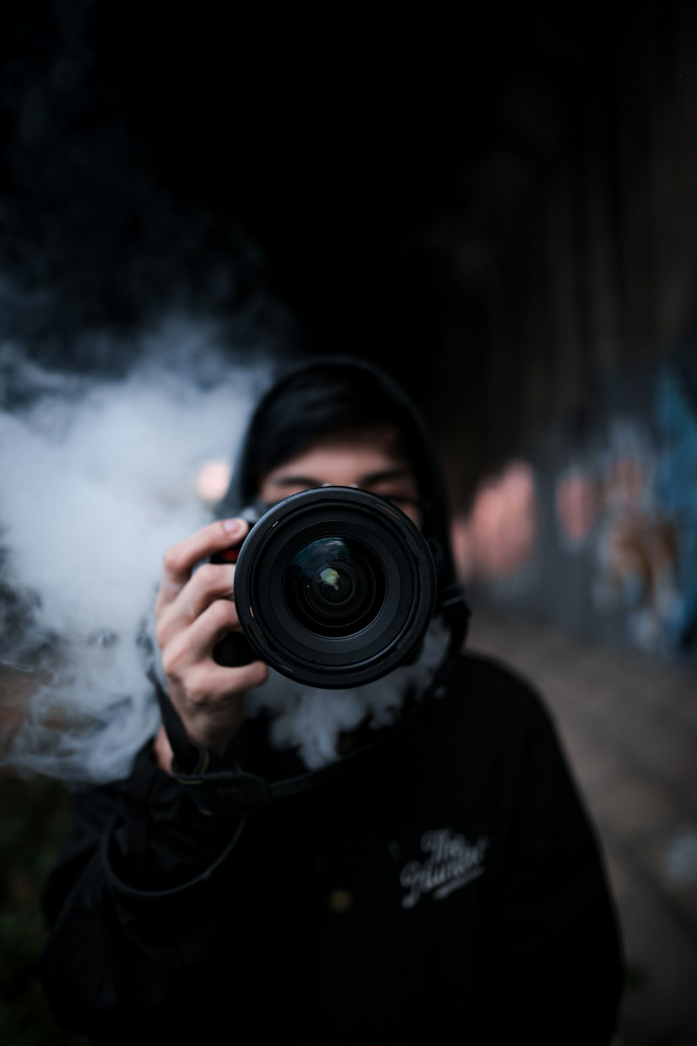 person holding black DSLR camera